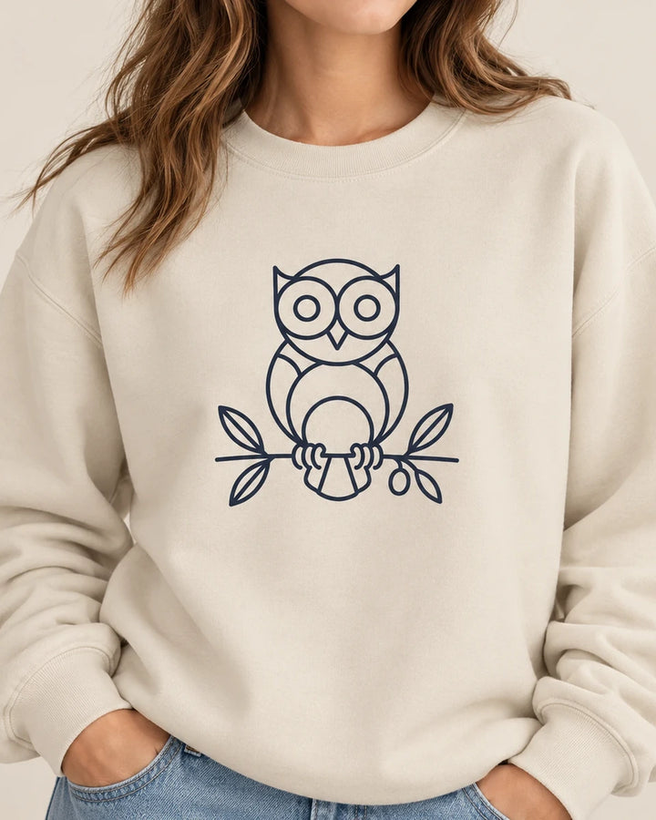 Owl Wisdom Sweatshirt in Sand - navy owl line art on unisex crewneck, design-first close-up lifestyle view, ToldPrint