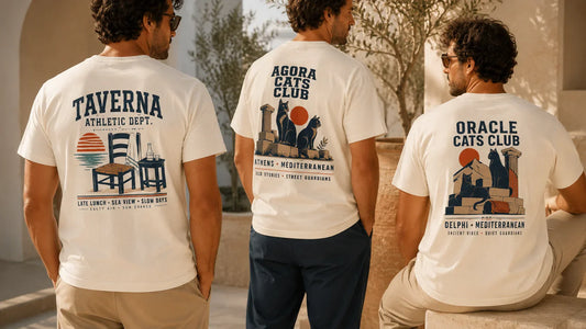 Three Mediterranean back print T-shirts showing Taverna Athletic Dept, Agora Cats Club and Oracle Cats Club designs in a warm resort setting