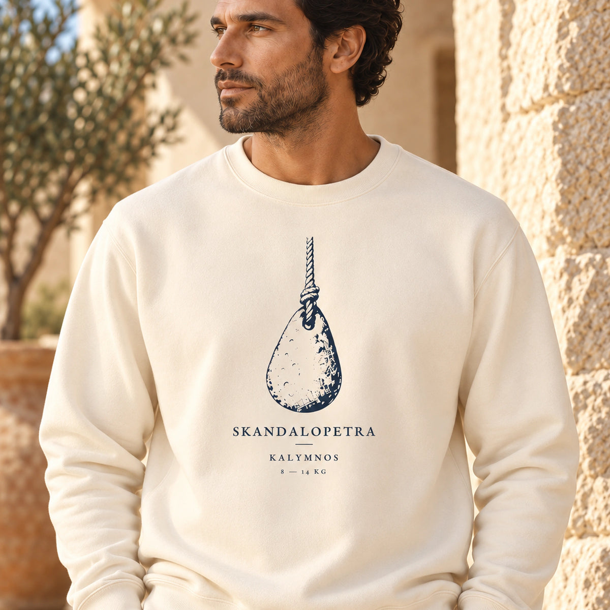 TP HERO: Skandalopetra Kalymnos Ivory lightweight crewneck on male model with close view of navy front artwork