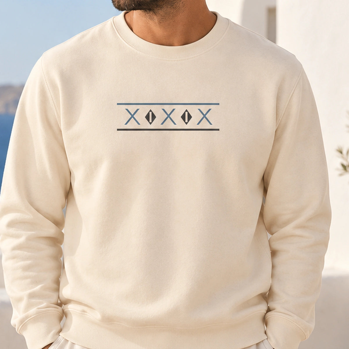 TP HERO: Tinos Dovecote Geometry Ivory crewneck worn by a male model, close framing on the geometric front print