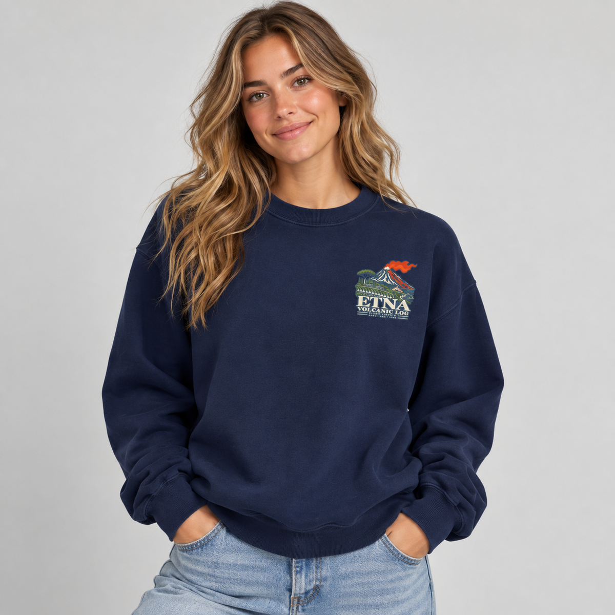 Etna Volcanic Log True Navy sweatshirt on model showing the small left-chest Mount Etna print.