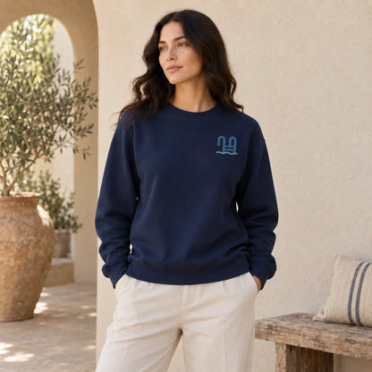 First Light Sea Swim True Navy sweatshirt front on approved Fall 2026 model with sea ladder chest mark
