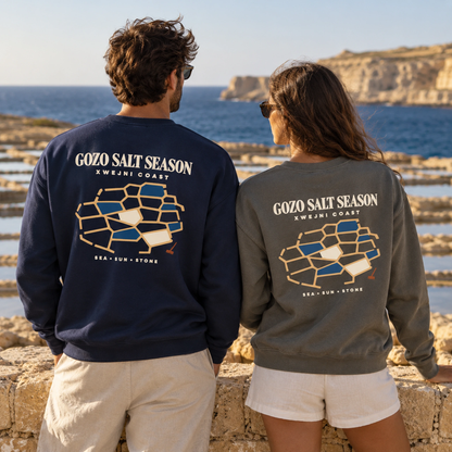 Lifestyle duo wearing Gozo Salt Season garment-dyed sweatshirts in True Navy and Pepper, inspired by the Xwejni salt pans of Gozo.