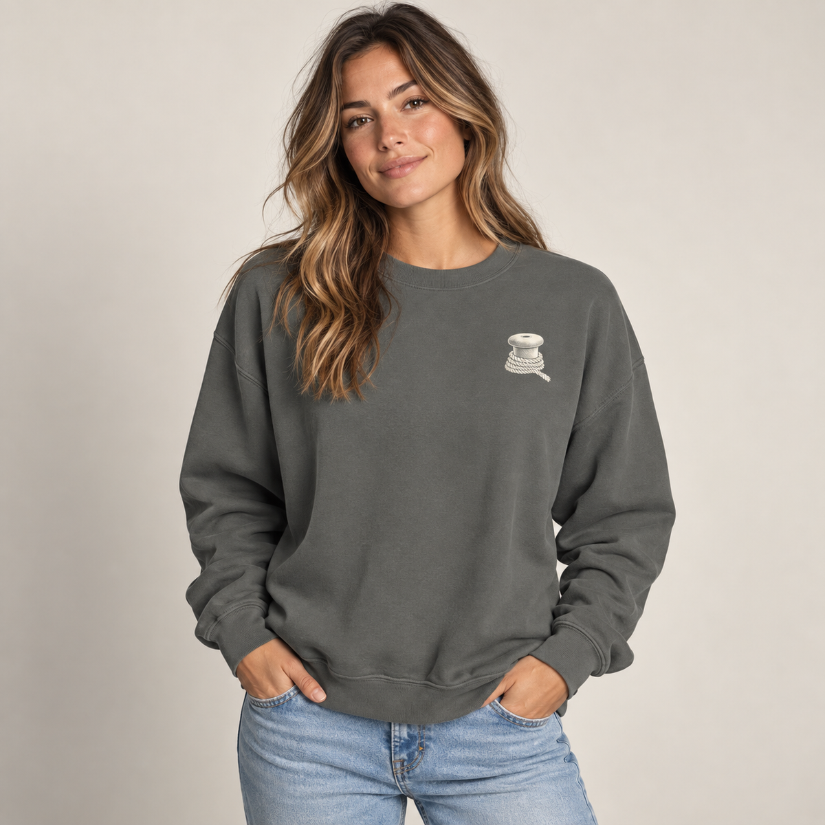 Last Ferry Home Pepper sweatshirt on model showing the small bollard and rope left-chest print.