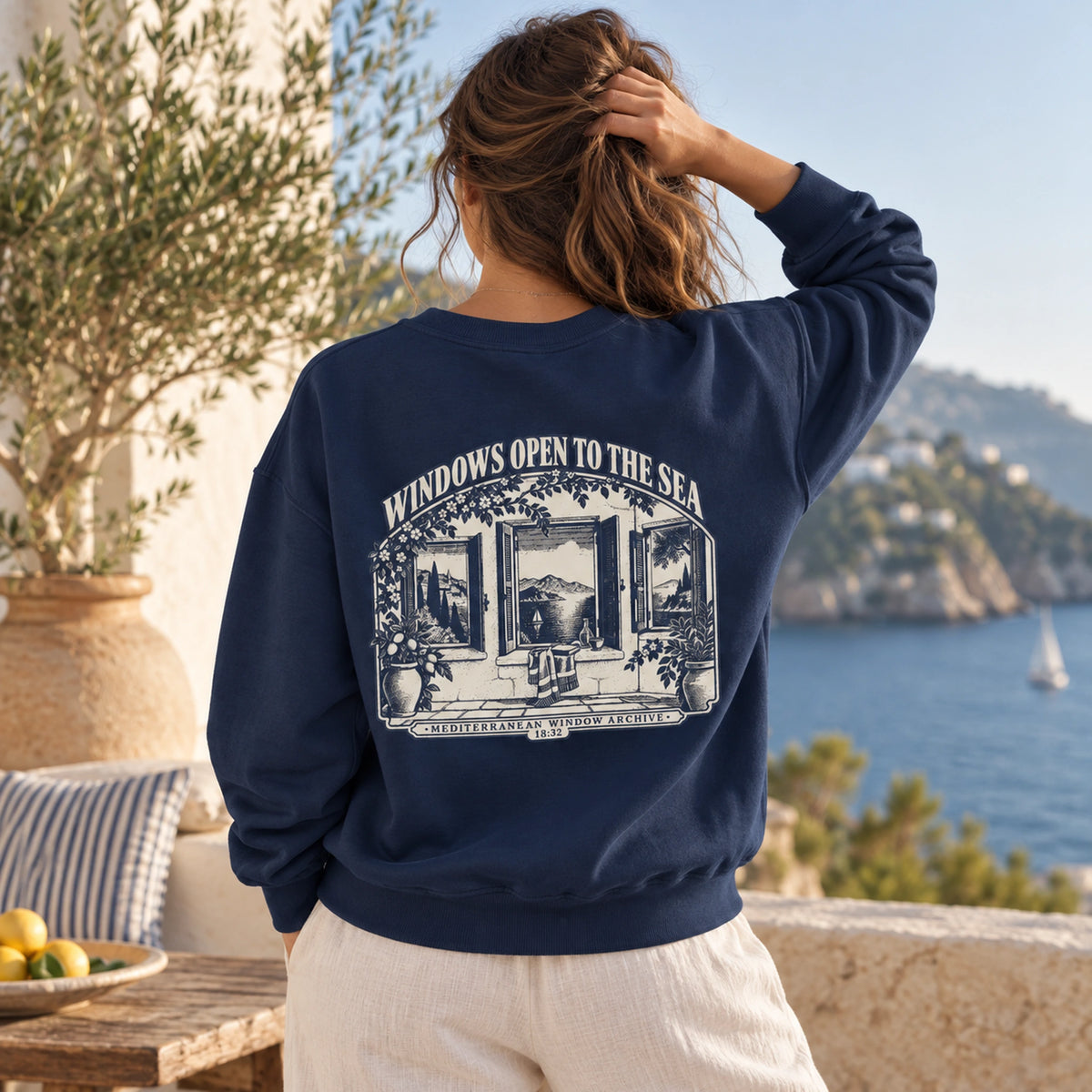 Windows Open to the Sea True Navy Comfort Colors 1566 sweatshirt shown from the back with large Mediterranean window graphic.