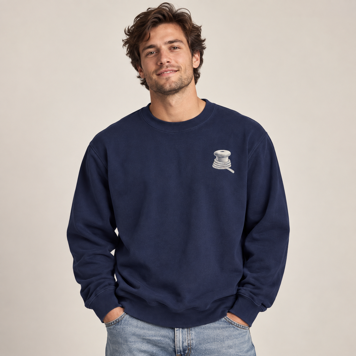 Last Ferry Home True Navy sweatshirt on model showing the small bollard and rope left-chest print.