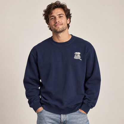 Last Ferry Home True Navy sweatshirt on model showing the small bollard and rope left-chest print.