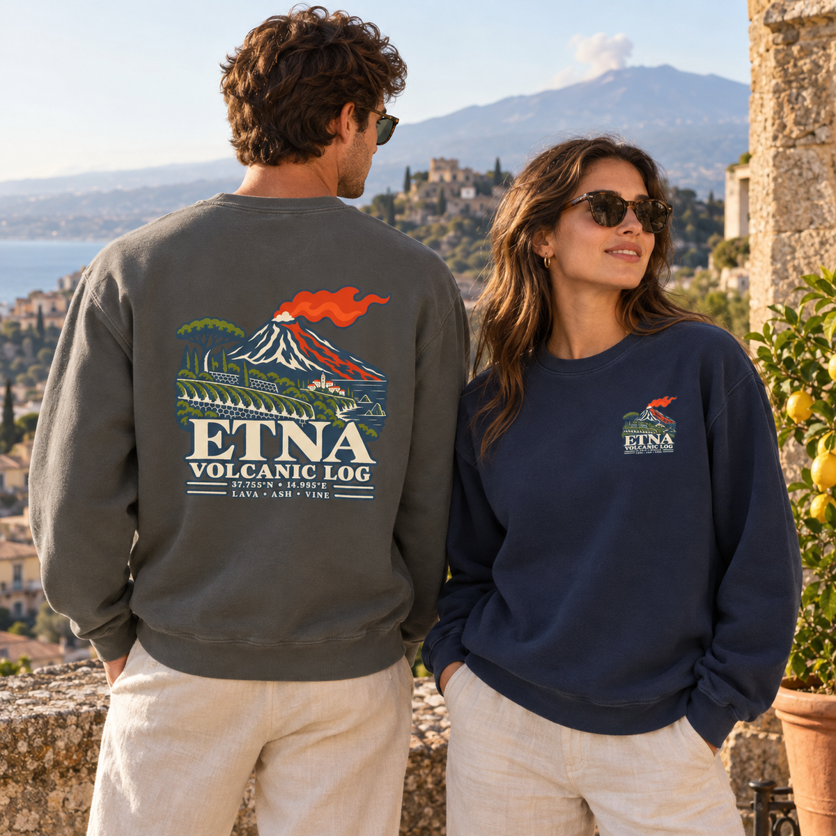 Etna Volcanic Log Pepper and True Navy sweatshirts styled in a Sicily-inspired Mediterranean setting.