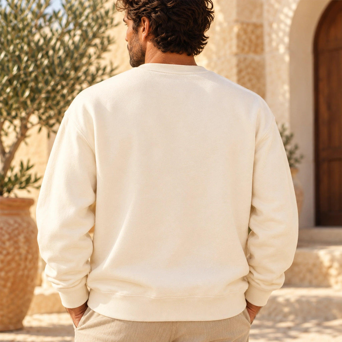 Clean back of the Cardó Ivory crewneck worn by a male model, without back print