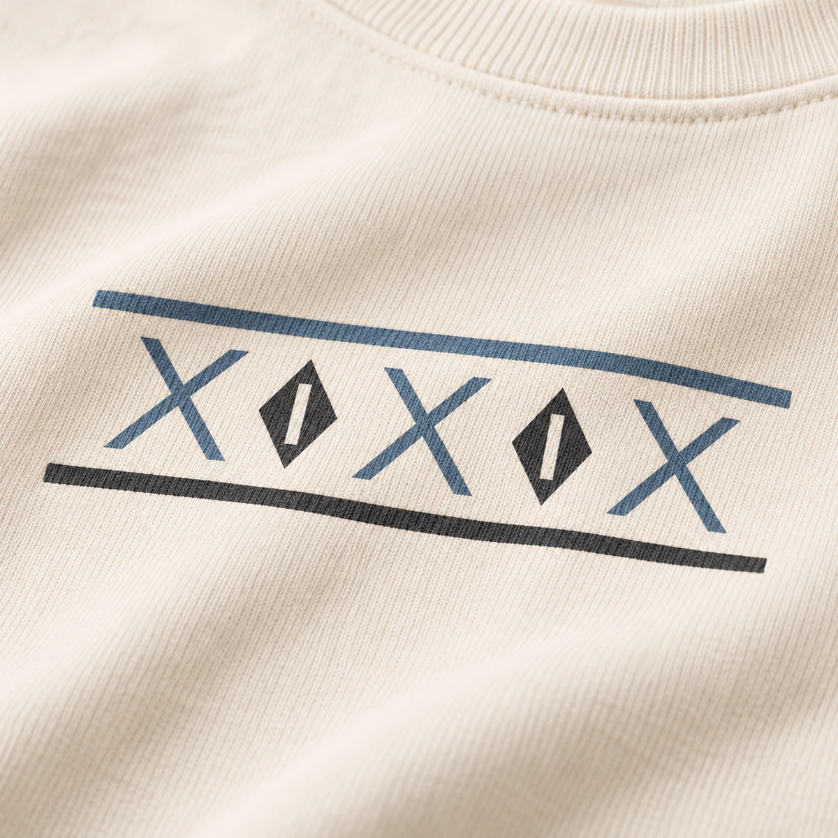 Close-up of the two-color geometric front print on Ivory Tinos Dovecote Geometry sweatshirt