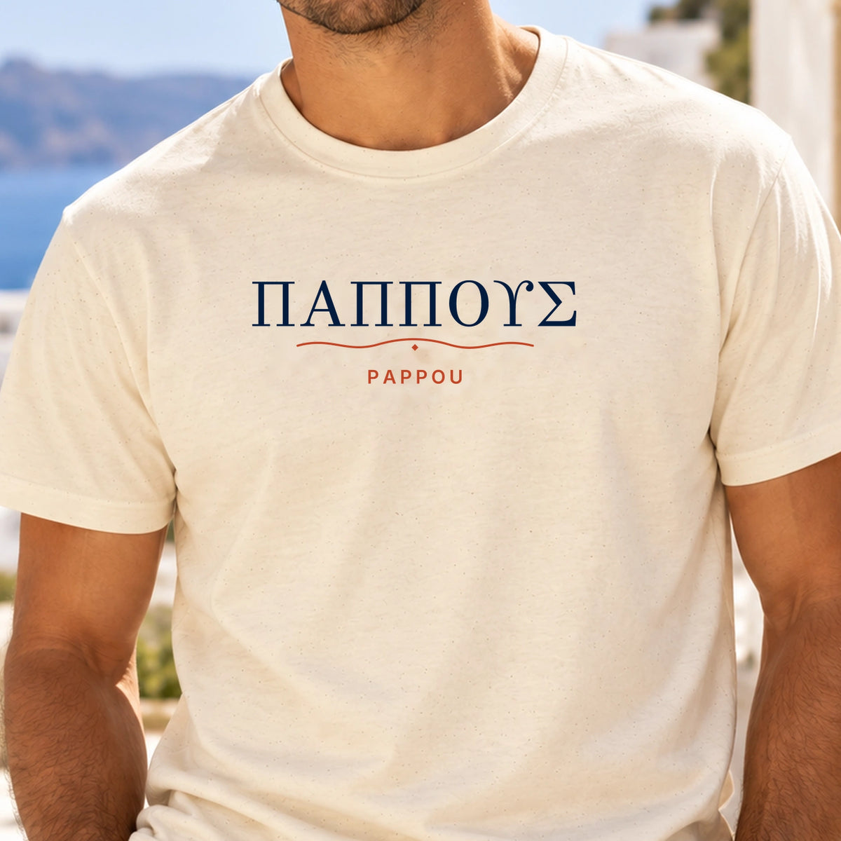 PAPPOU navy Greek lettering and terracotta family thread print close-up on Natural tee