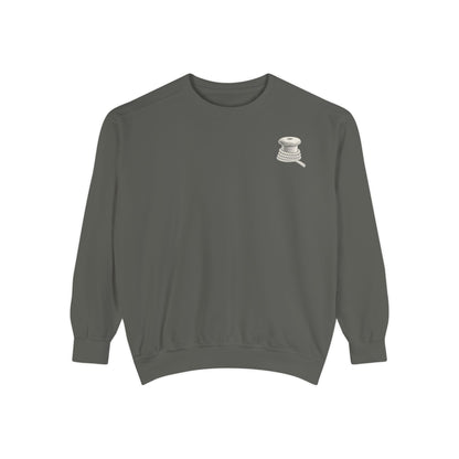Pepper Comfort Colors 1566 sweatshirt flat lay showing the Last Ferry Home chest mark.