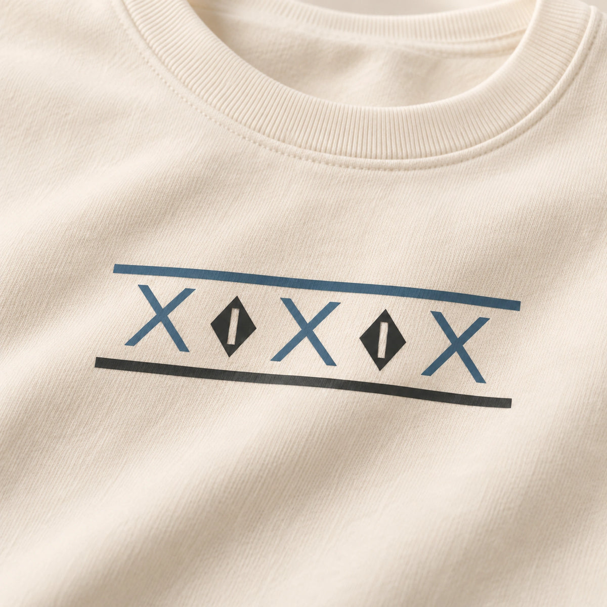 Detailed view of Tinos Dovecote Geometry geometric DTG front print and Ivory fabric texture
