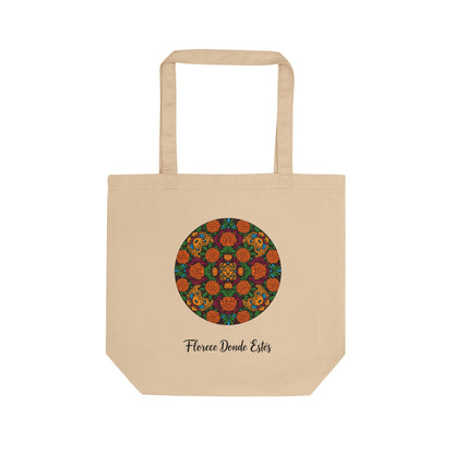 Beige tote bag with a colorful circular pattern and text on a white background