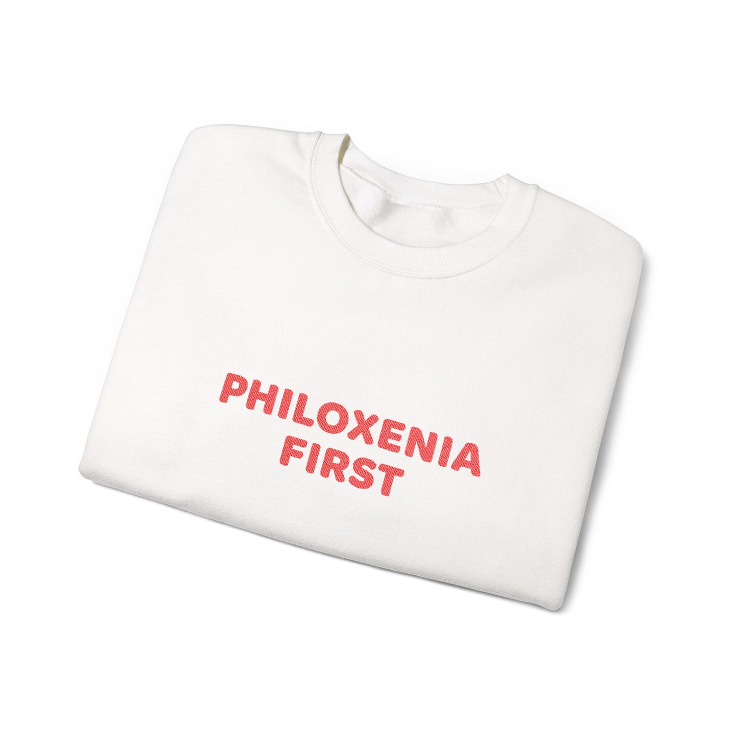 White sweatshirt with 'PHILOXENIA FIRST' text in red on a white background