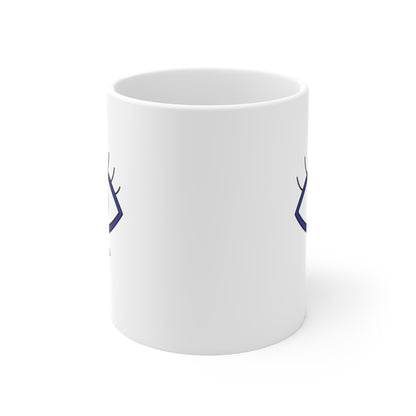 White mug with blue designs on a white background
