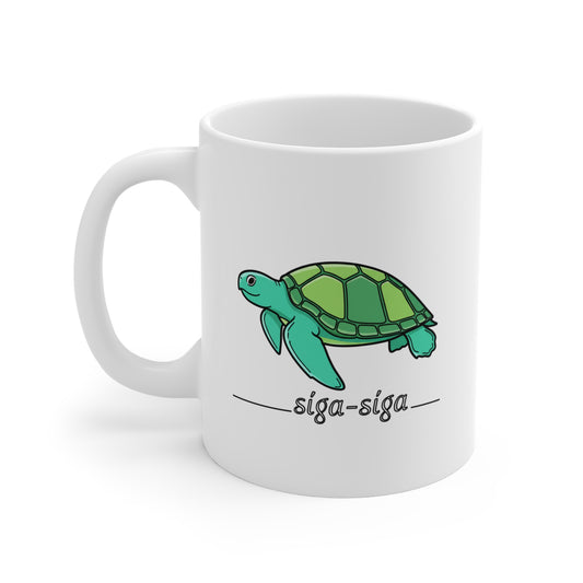 White mug with a green turtle illustration and 'siga-siga' text on a white background