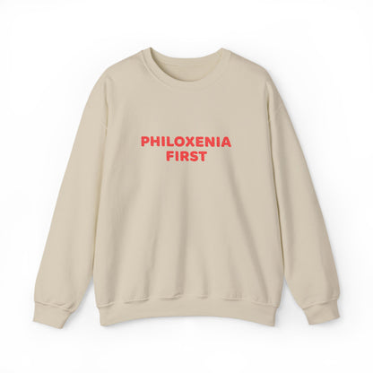 Beige sweatshirt with 'PHILOXENIA FIRST' text in red on a white background