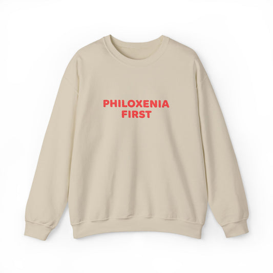Beige sweatshirt with 'PHILOXENIA FIRST' text in red on a white background