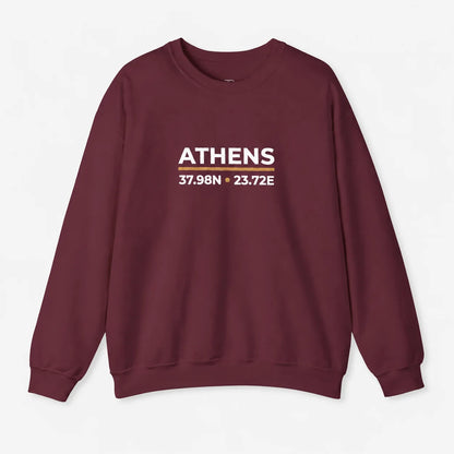 A crewneck sweatshirt in maroon with a graphic on the chest reading 'ATHENS 37.98N .