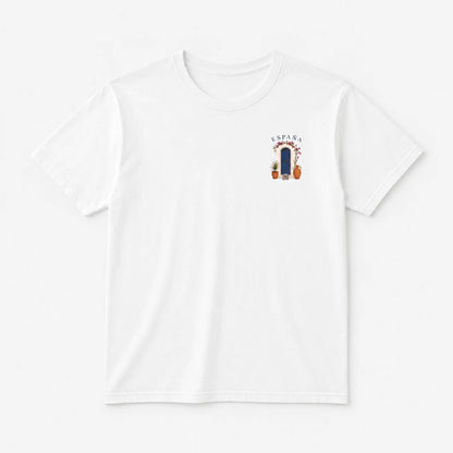 A white short-sleeve crewneck t-shirt with a small graphic on the left chest featuring the word 'KAPAR' above a dark blue vertical shape with orange and red details, displayed on a clean white background.