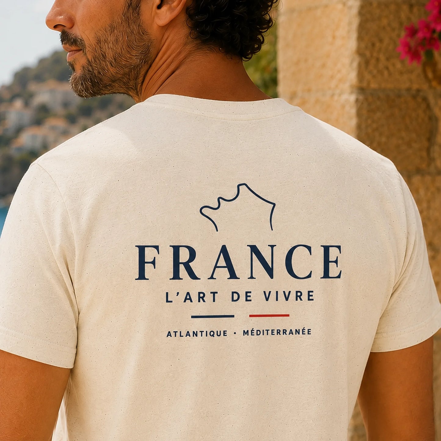 TP HERO: A man shown from behind wearing a cream-colored t-shirt with a dark blue graphic print of the outline of France and the text 'FRANCE L'ART DE VIVRE'.
