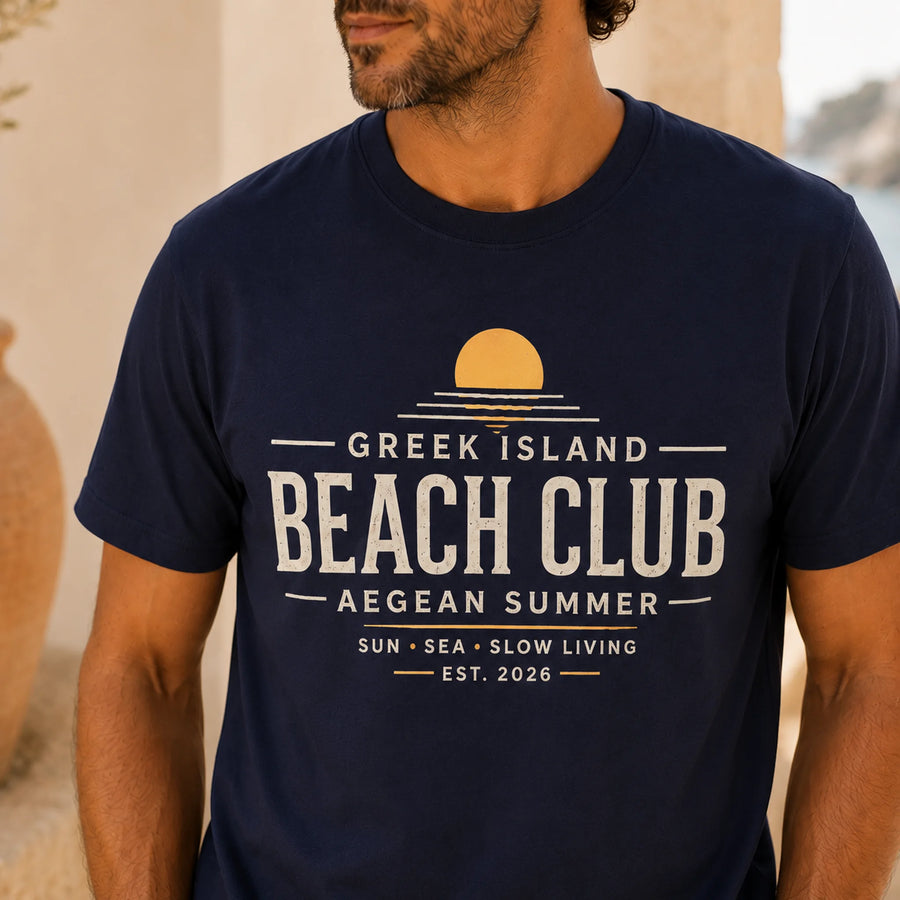 TP HERO: Person wearing a navy blue t-shirt with 'Greek Island Beach Club' text and design.