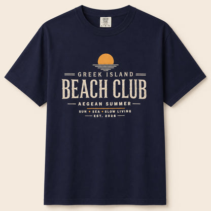 Navy blue t-shirt with 'Greek Island Beach Club' text and graphic on a beige background