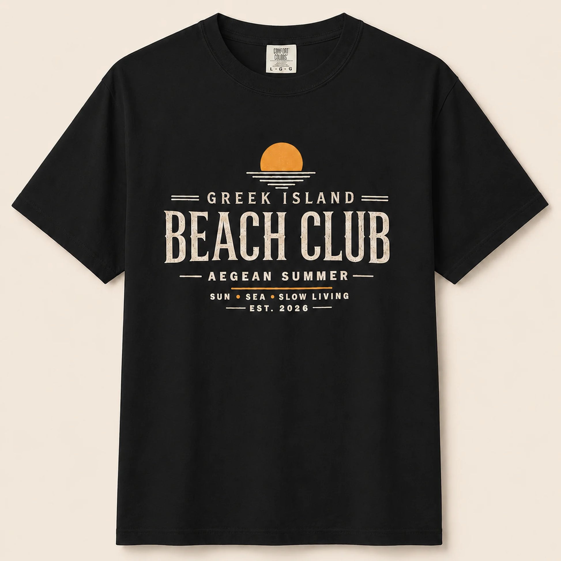 Black t-shirt with 'Greek Island Beach Club' text and design on a beige background