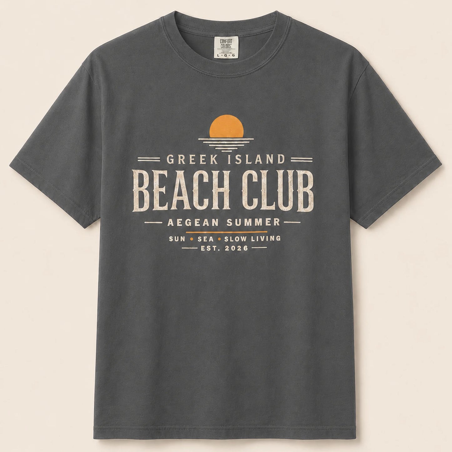 Gray t-shirt with 'Greek Island Beach Club' text and logo on a beige background