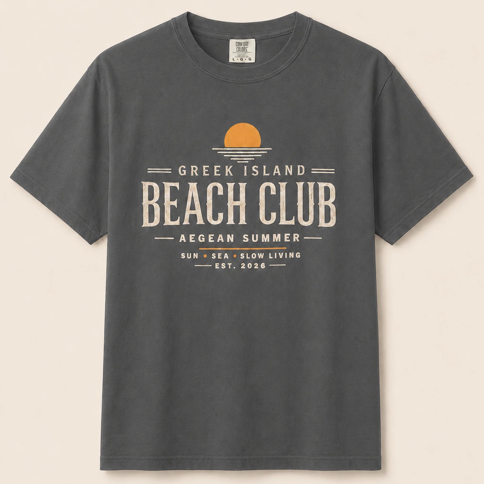 Gray t-shirt with 'Greek Island Beach Club' text and logo on a beige background