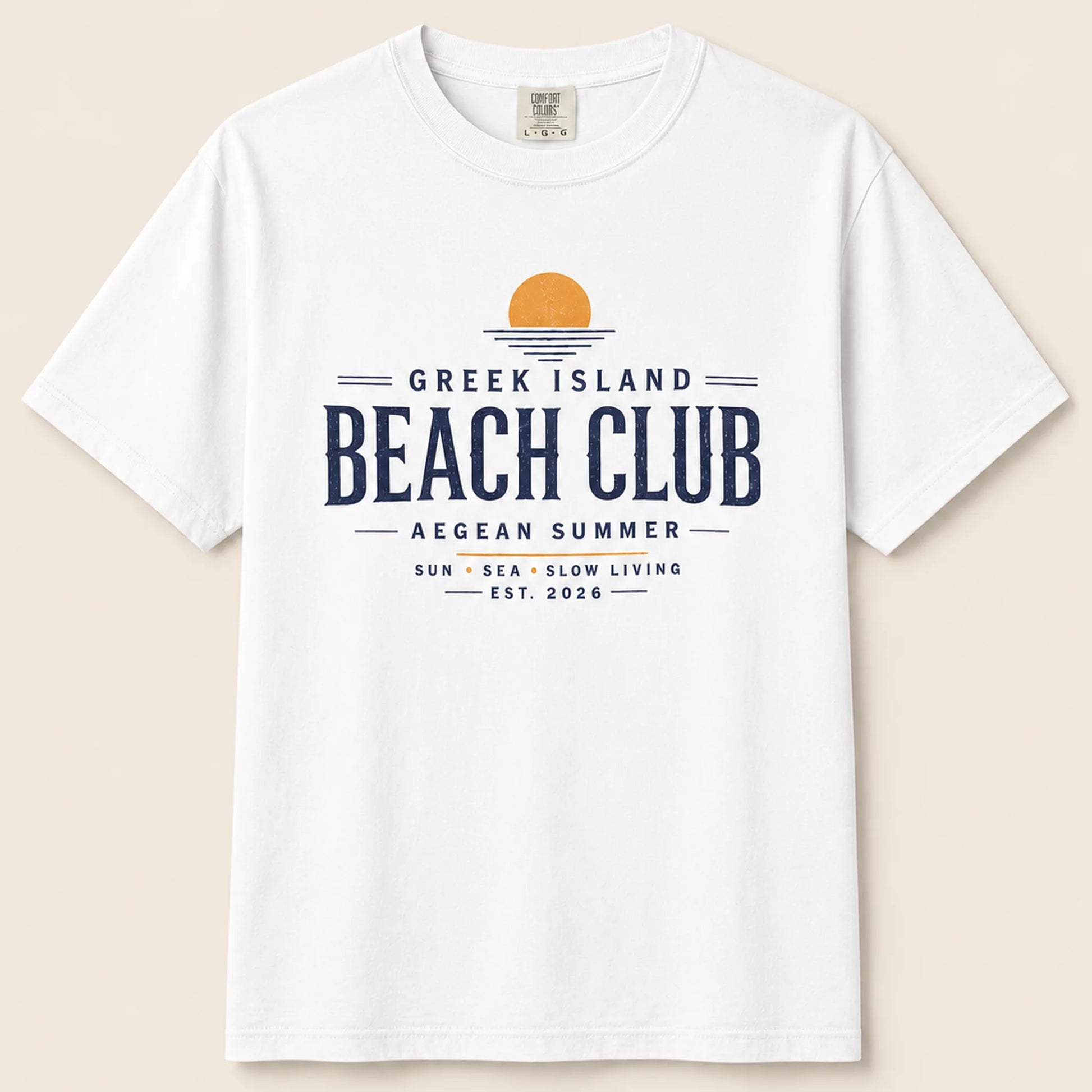 White t-shirt with 'Greek Island Beach Club' text design on a beige background