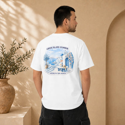 A man wearing a white short-sleeve t-shirt with a large graphic print on the back, standing in a warm beige environment with a potted plant in the background.
