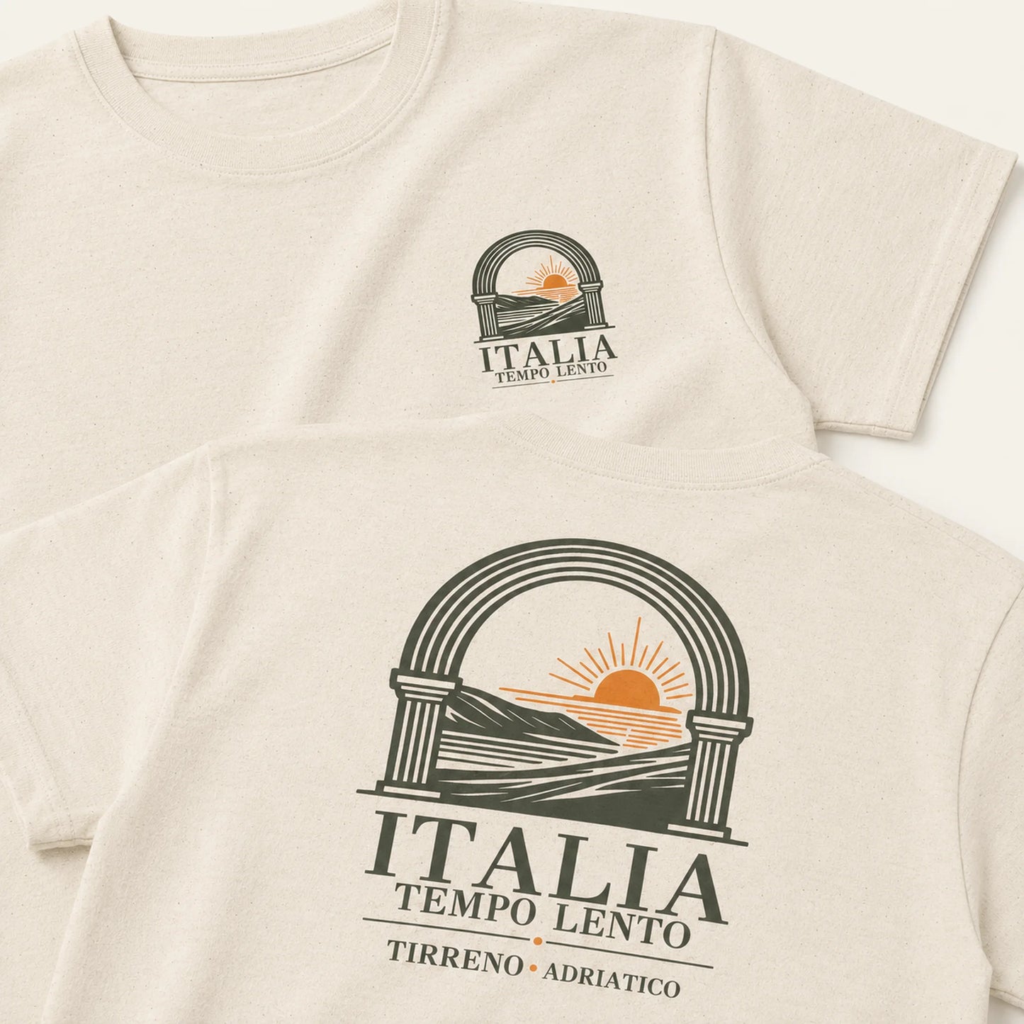 Two cream-colored short-sleeve t-shirts shown in a flat-lay arrangement, displaying the front and back of the design. The design features a dark green arch graphic with a yellow-orange rising sun over hills, with the text 'ITALIA TEMPO LENTO' and 'TIRRENO • ADRIATICO'.