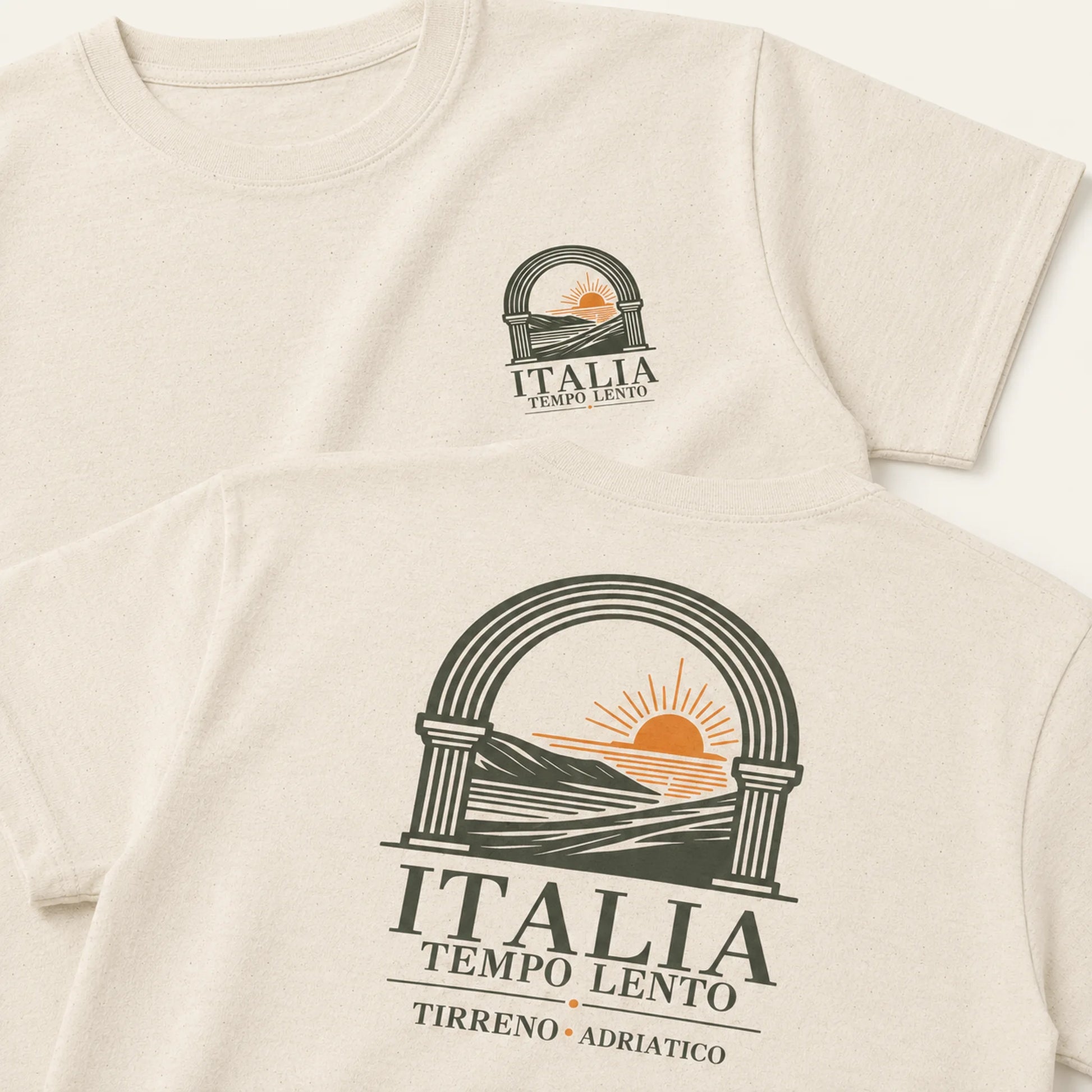 Two cream-colored short-sleeve t-shirts shown in a flat-lay arrangement, displaying the front and back of the design. The design features a dark green arch graphic with a yellow-orange rising sun over hills, with the text 'ITALIA TEMPO LENTO' and 'TIRRENO • ADRIATICO'.
