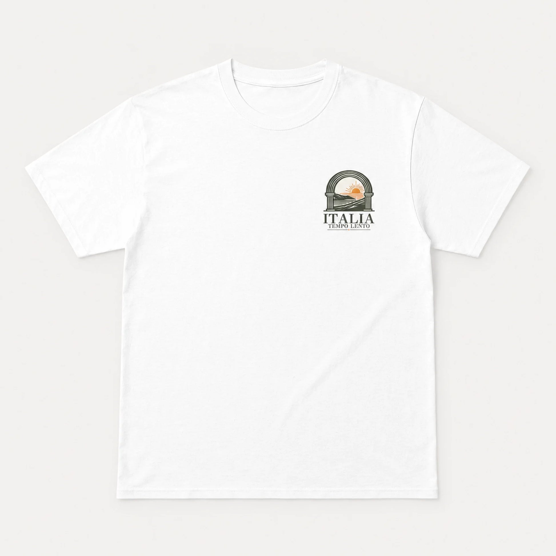 A white short-sleeve t-shirt with a small graphic on the left chest depicting a scenic archway with a sunset and the text 'ITALIA'.