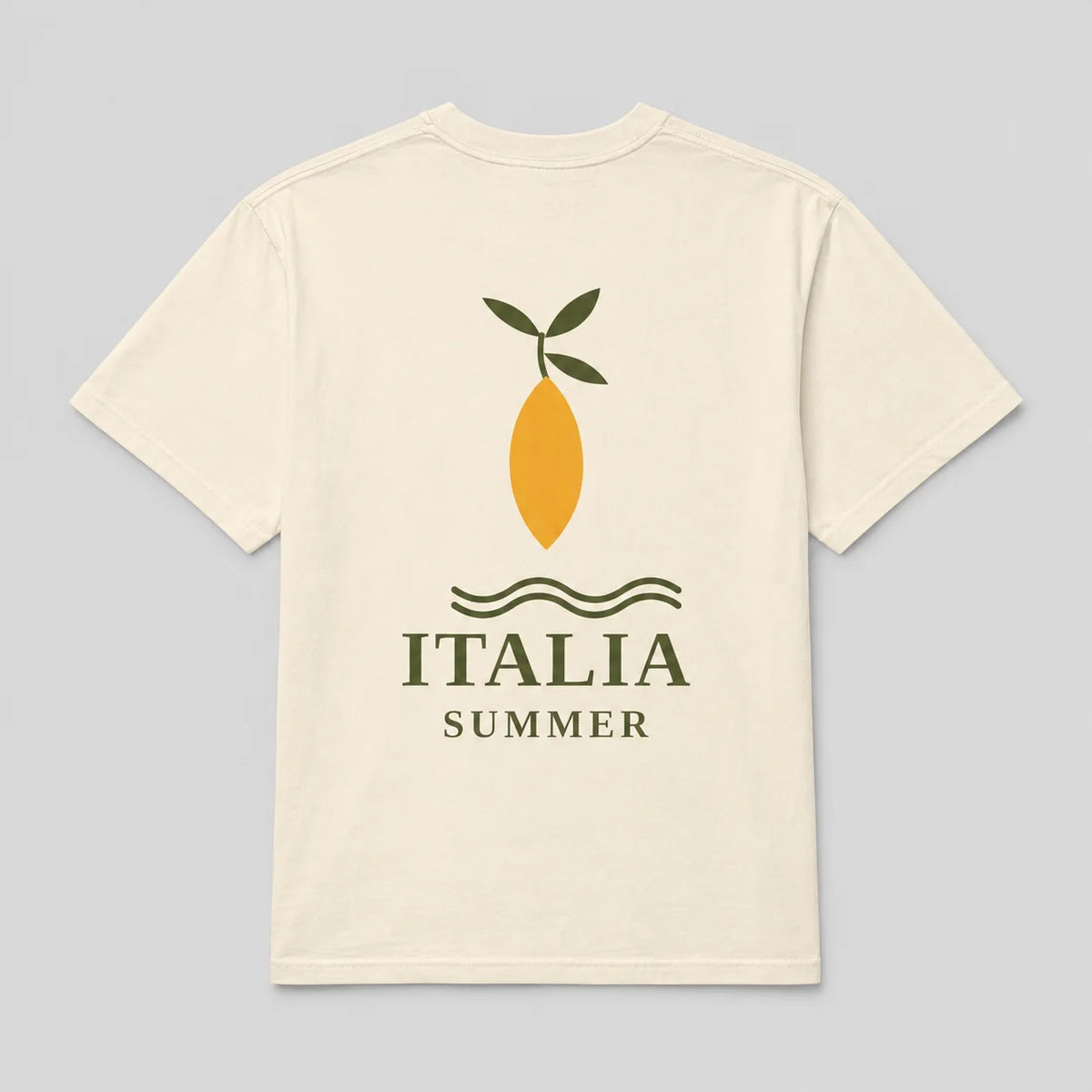 A cream-colored short-sleeve t-shirt with a graphic on the front depicting a yellow lemon with green leaves, wavy lines, and the text 'ITALIA SUMMER' in dark green, set against a solid light gray background.
