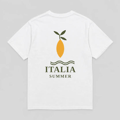 A white short-sleeve t-shirt shown from the back, featuring a graphic print of a yellow lemon with green leaves, wavy lines, and the text 'ITALIA SUMMER' in dark green.