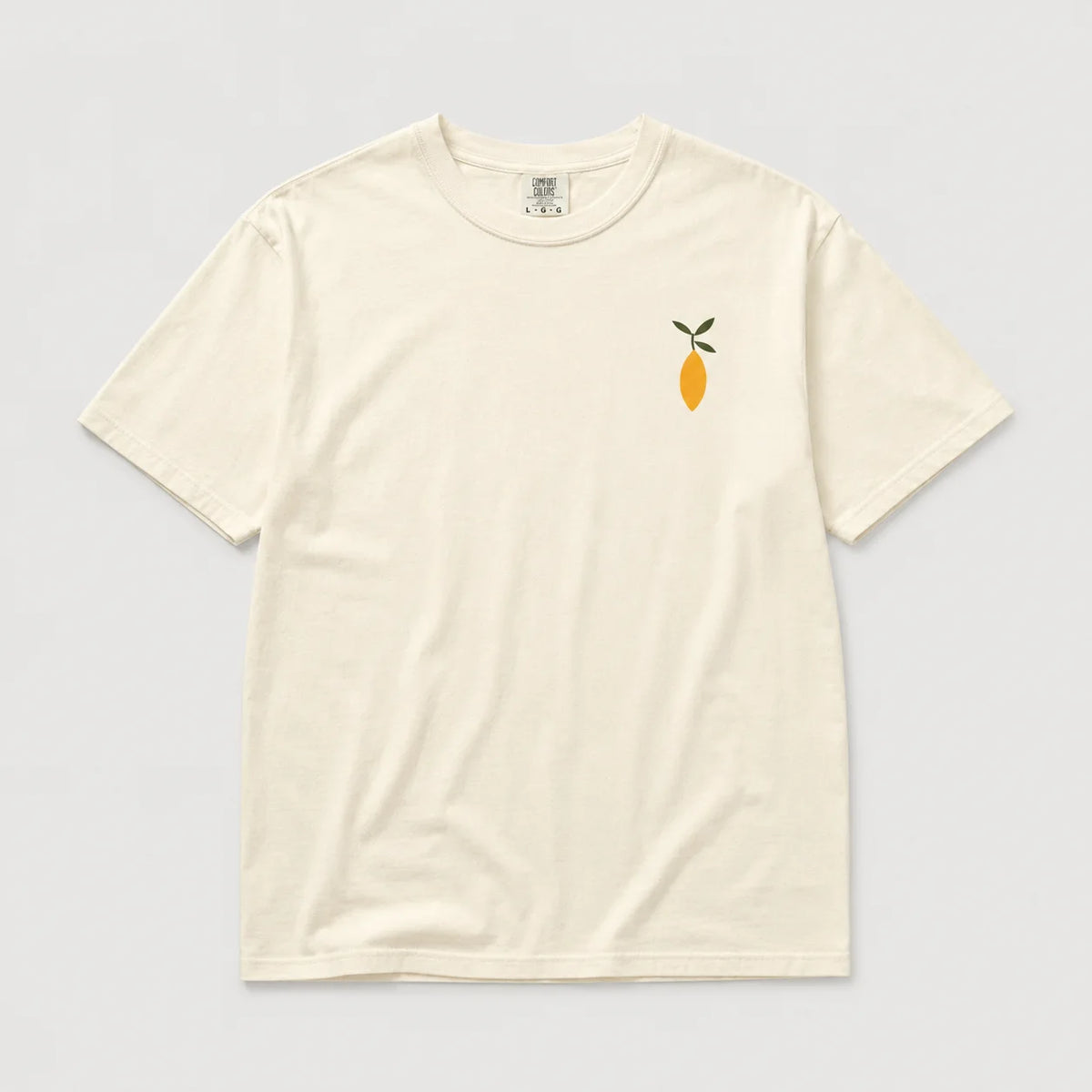 An off-white short-sleeve crewneck t-shirt featuring a small embroidered lemon graphic with green leaves on the left chest, displayed flat against a light gray background.