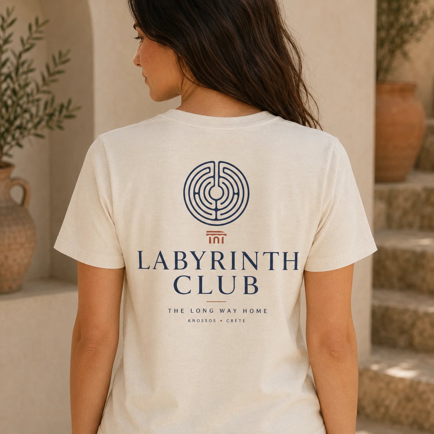 TP HERO: Person wearing a 'Labyrinth Club' t-shirt with a maze design in an indoor setting.