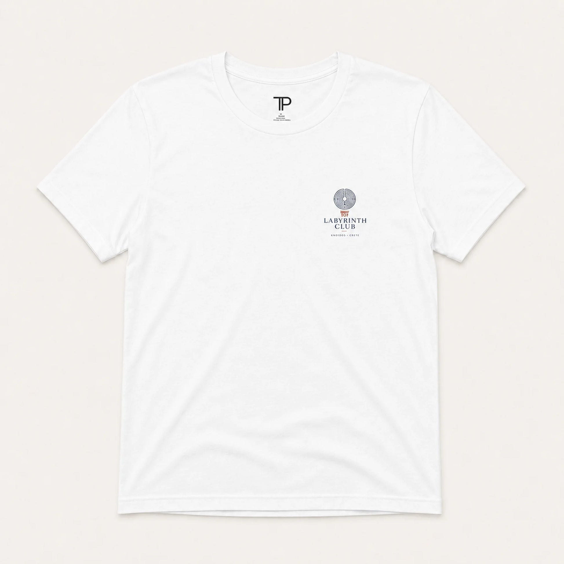 White t-shirt with logos on a light beige background