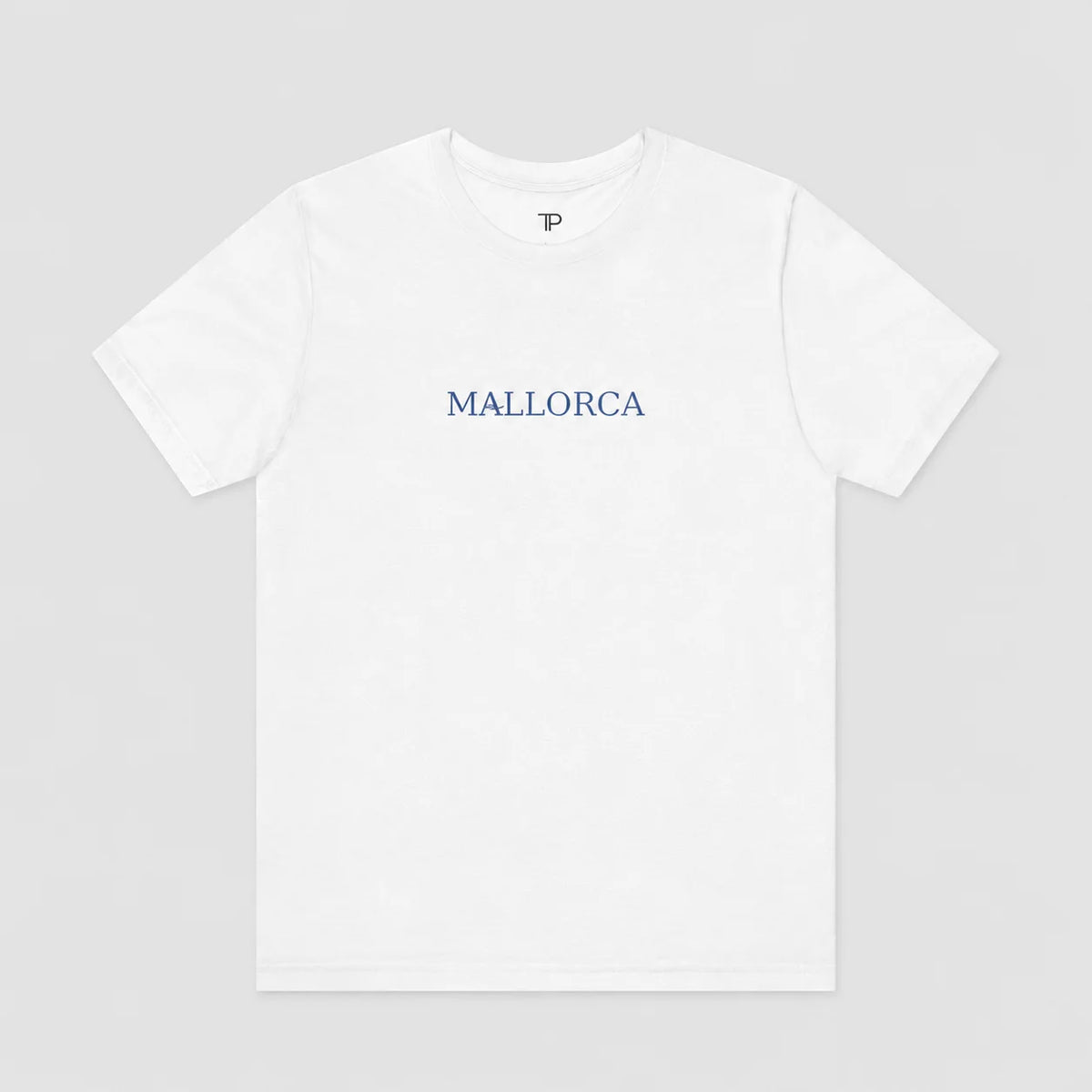 A white short-sleeve crewneck t-shirt with 'MALLORCA' printed in blue across the chest, displayed flat against a light gray background.