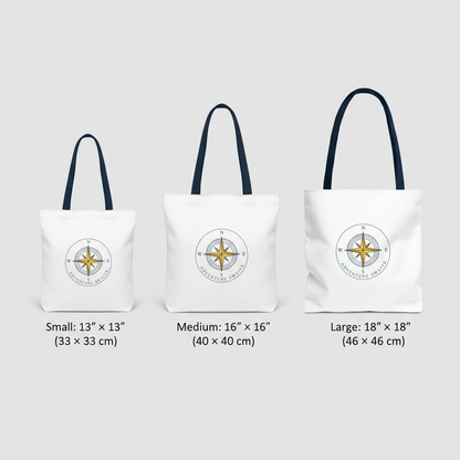 Three tote bags with different sizes and a compass design on a light gray background.