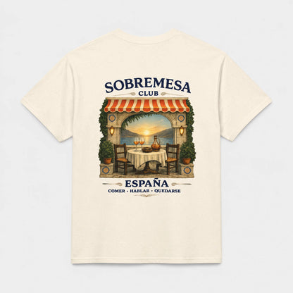 An off-white short-sleeve t-shirt with a large graphic print on the back, featuring a retro-style restaurant scene with the text 'SOBREMESA CLUB' and 'ESPAÑA COMER - HABLAR - OUIDARSE'.
