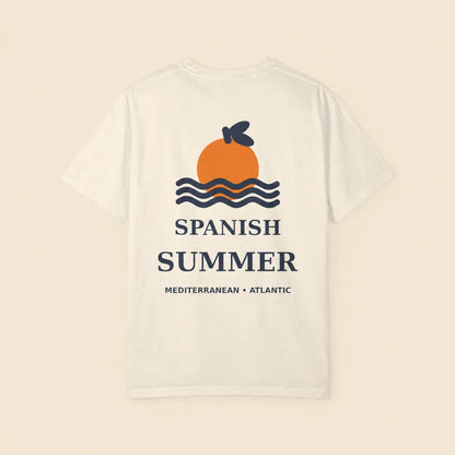 A white short-sleeve t-shirt with a graphic on the back featuring an orange sun, blue waves, and the text 'SPANISH SUMMER' and 'MEDITERRANEAN • ATLANTIC' on a light beige background.