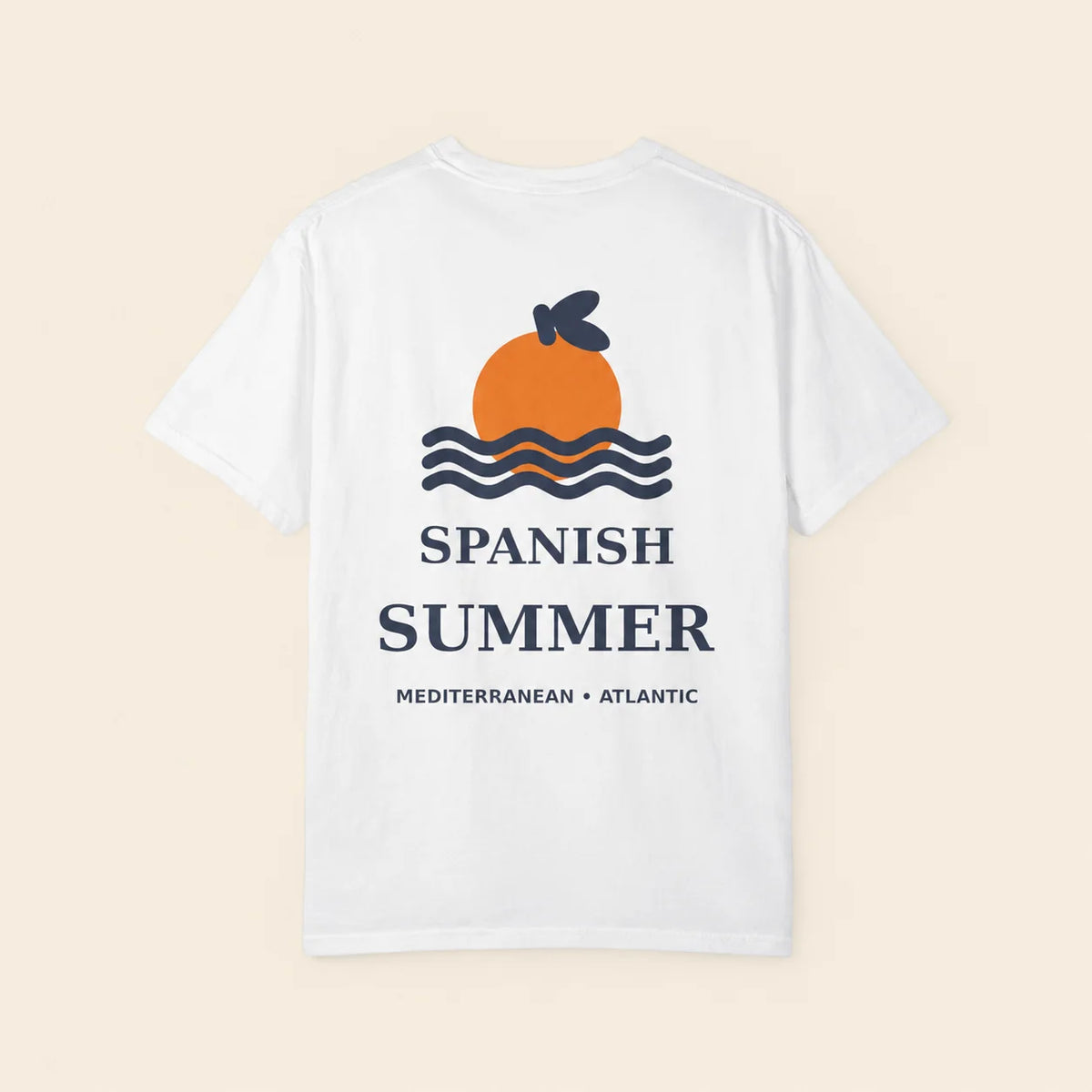 A white short-sleeve t-shirt shown flat against a light beige background. The back of the shirt features a graphic of an orange with a dark blue leaf, wavy blue lines, and the text 'SPANISH SUMMER' and 'MEDITERRANEAN • ATLANTIC' in dark blue.
