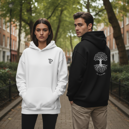 Two people wearing hoodies with logos in an outdoor setting