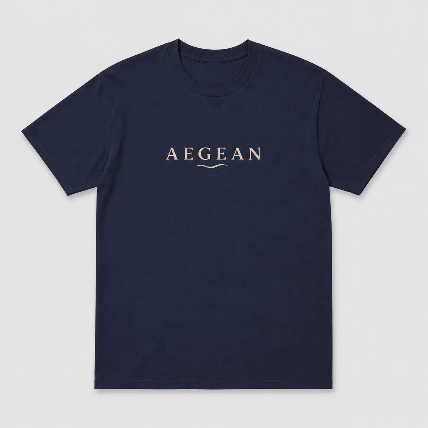 A navy blue short-sleeve crewneck t-shirt with the word 'AEGEAN' printed in a light beige serif font across the chest, accompanied by a small wave graphic underneath, shown on a light gray background.
