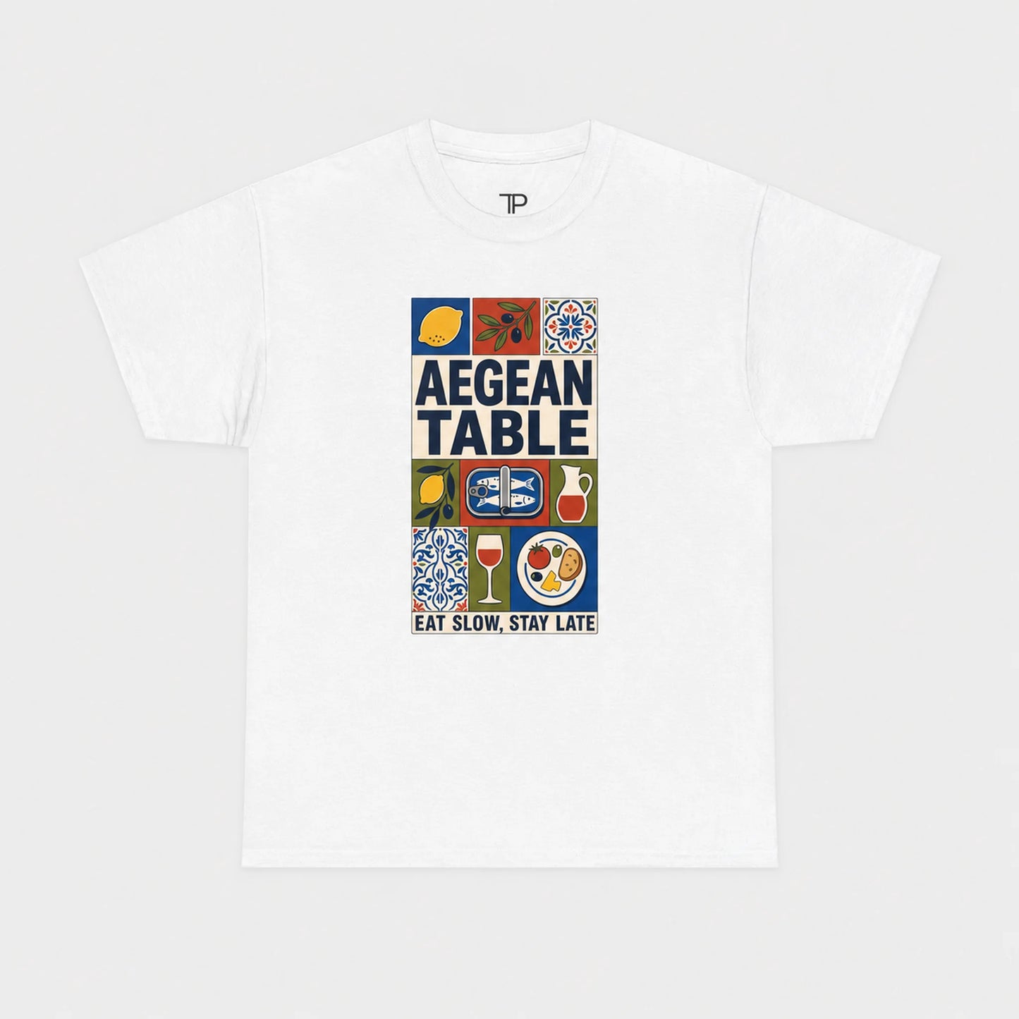 White t-shirt with 'Aegean Table' graphic design on a white background