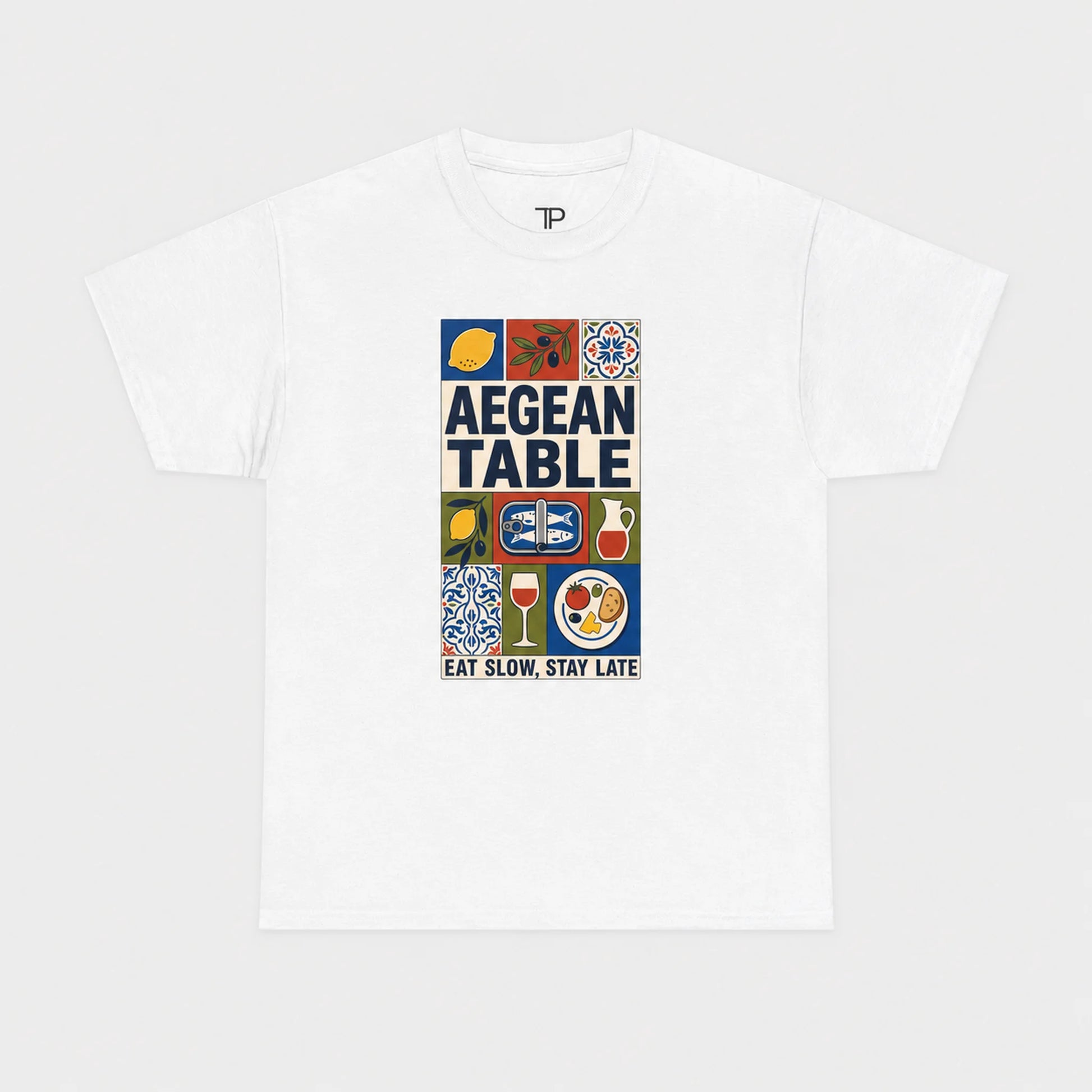 White t-shirt with 'Aegean Table' graphic design on a white background